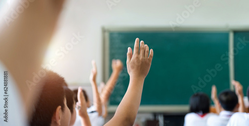 Foto Group of raised hands in class of middle school