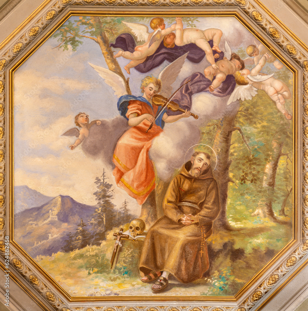 GENOVA, ITALY - MARCH 6, 2023: The ceiling fresco of St. Francis of Assisi among the angels in the church Chiesa di Santa Caterina from 19. cent.