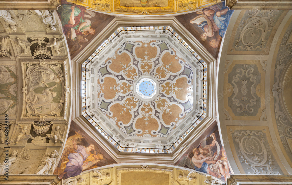 GENOVA, ITALY - MARCH 7, 2023: The cupola of church Chiesa di san Pietro in Banchi with the four Evangelist by Paolo Gerolamo Piola (end of 17. cent).