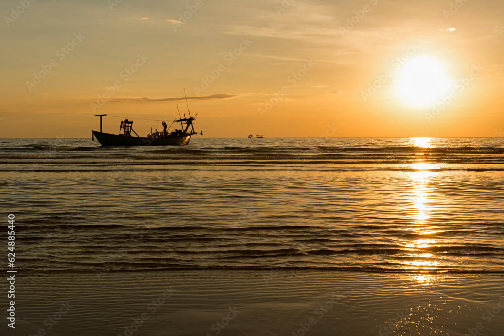 Boats on the sea with the sun in the background