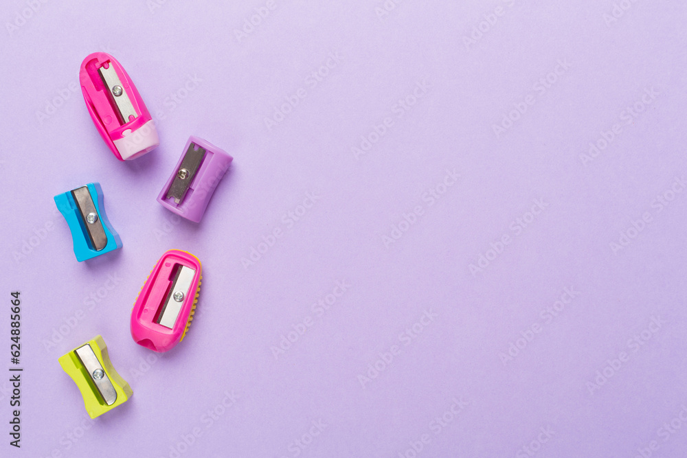 Different sharpeners on color backgroung, top view Different sharpeners on color backgroung, top view