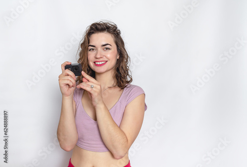 Portrait of a lovely woman. Dressed in a lilac top. Take a photo.