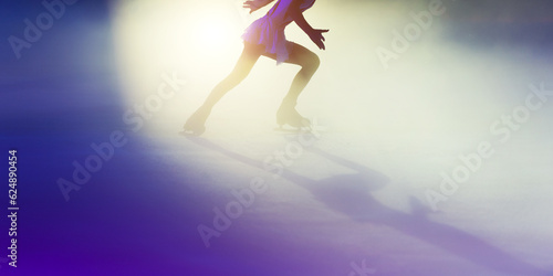 Photos Young girl ice figure skating with beautiful light effect