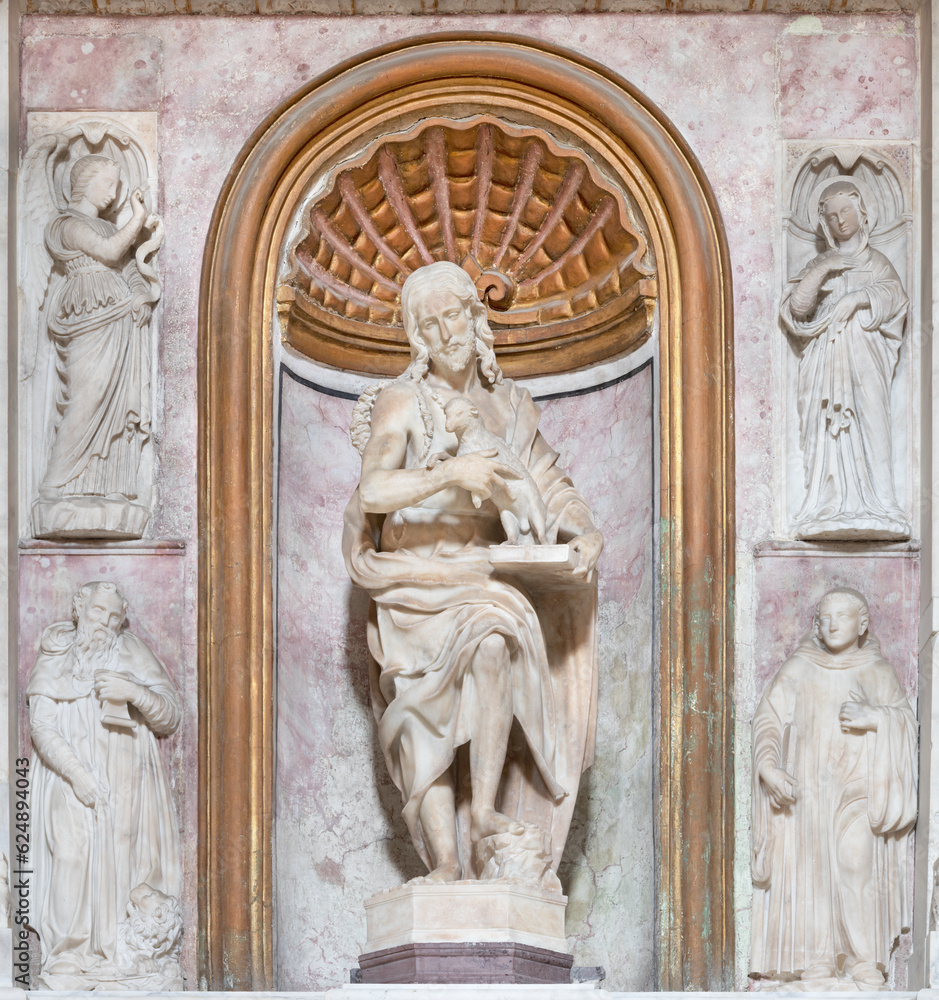 NAPLES, ITALY - APRIL 21, 2023: The marble statue of John the Baptist among the St. Jerome and Geatano the church Chiesa di Sant'Anna dei Lombardi by Giovanni da Nola (1516).