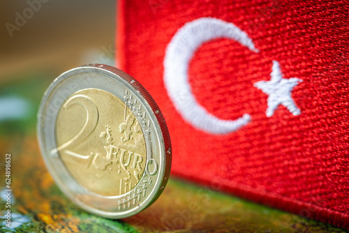 2 euro coin on the background of the flag of Turkey, Concept, Trade cooperation, Between the euro area and Turkey, Business relations of the euro and the Turkish lira