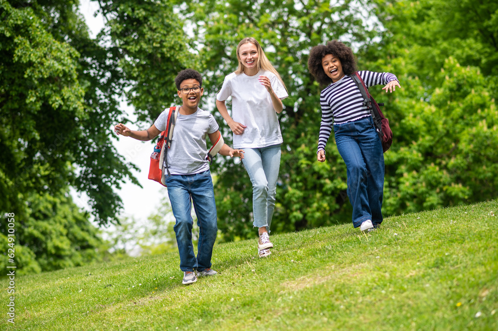 Obraz premium Group of young people feeling excited and happy in the park