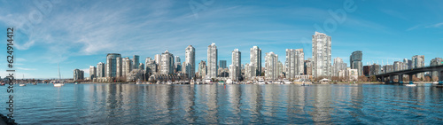 Panorama View of Cityscape Downtown Vancouver from Charleson Park. Nice weather, Downtown buildings, False Creek can be seen in an image.