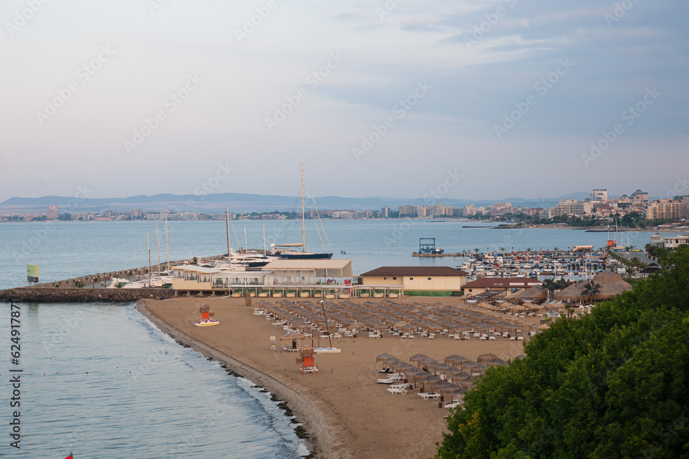View of the deserted beach and port, in the early morning at sunrise