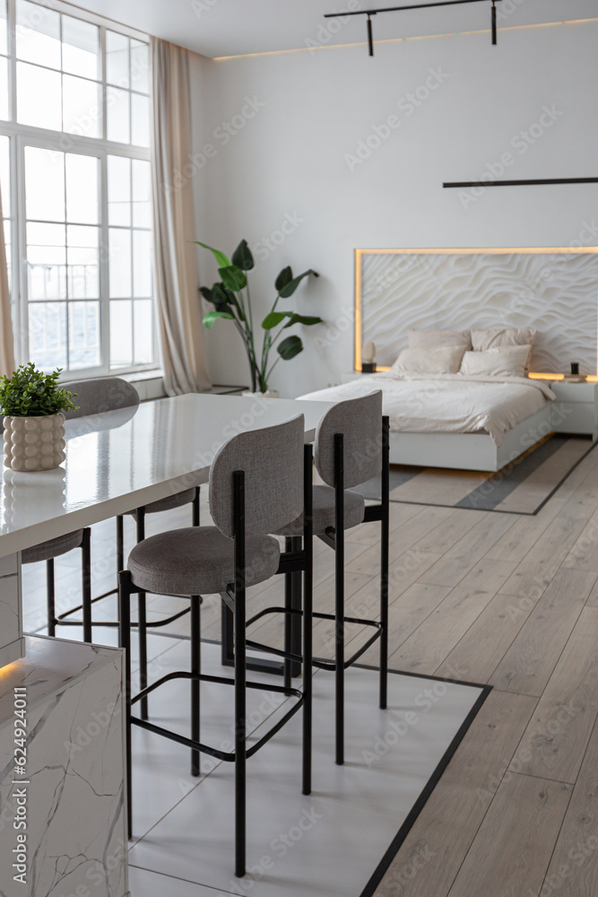 minimalistic modern luxury design of an expensive house with marble trim on a sunny day. white walls with plaster, parquet, decorative lighting and no one inside minimalistic modern luxury design of an expensive house with marble trim on a sunny day. white walls with plaster, parquet, decorative lighting and no one inside