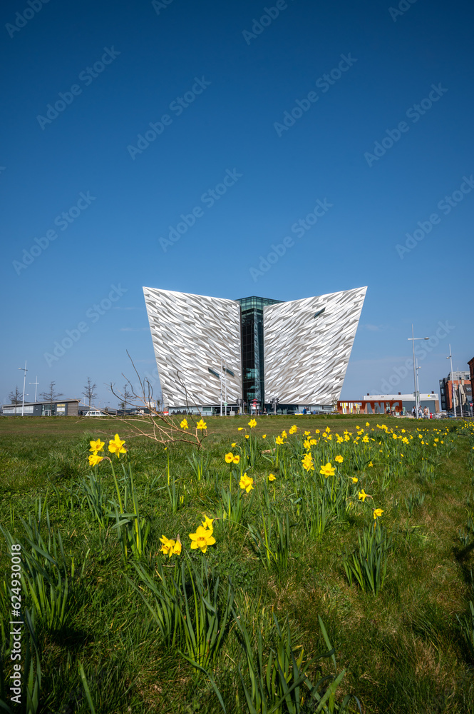 The Beautiful Exterior of the Titanic Museum in Titanic Quarter with beautiful yellow tiny flowers view in its front