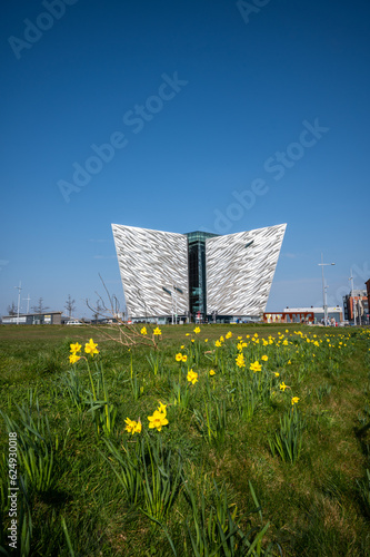 The Beautiful Exterior of the Titanic Museum in Titanic Quarter with beautiful yellow tiny flowers view in its front