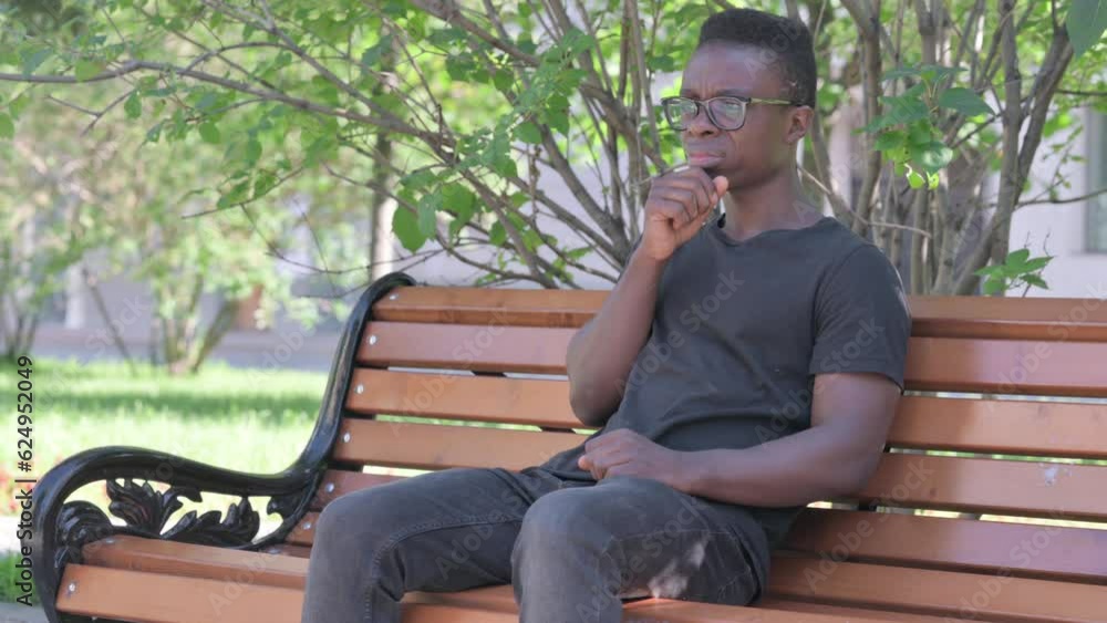 Coughing Young African Man Sitting Outdoor Coughing Young African Man Sitting Outdoor