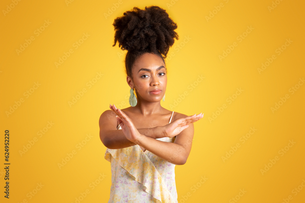 Sad confident young black woman crossed her arms, making stop sign Sad confident young black woman crossed her arms, making stop sign