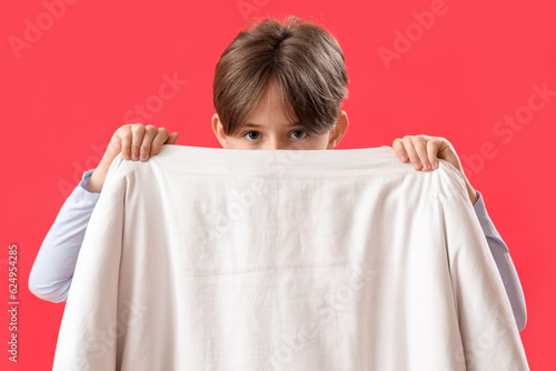 Little boy with blanket on ...