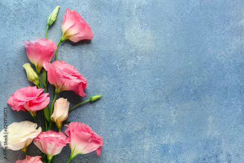 Fototapeta Naklejka Na Ścianę i Meble -  Beautiful pink eustoma flowers on blue background