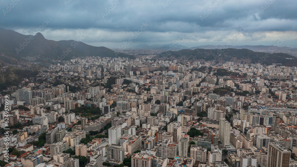 Aerial view of the North Zone of Rio de Janeiro on a cloudy day, in the neighborhoods of Tijuca and adjacencies and its green areas such as the Tijuca National Park.