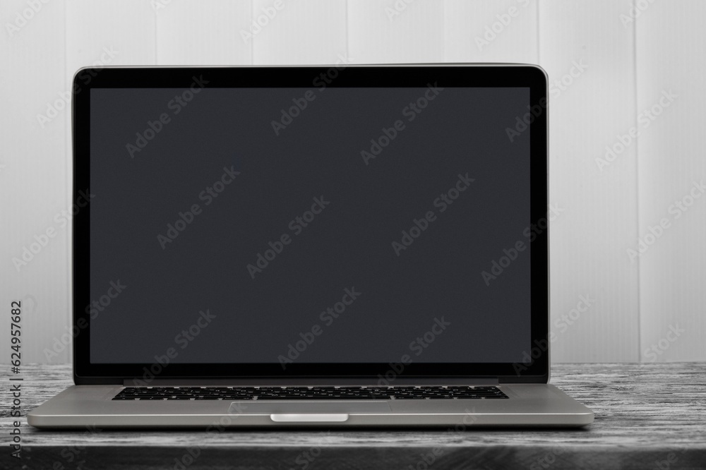 Open laptop with blank screen at the desk Open laptop with blank screen at the desk