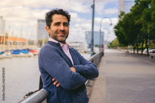Confident Middle-aged Latin Businessman with Arms Crossed Smiling at the Camera, Copy Space