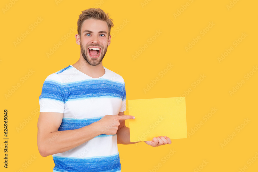 surprised man sales representative offer advertisement. man offer his advertisement. man holds paper with special offer advertisement. man show advertisement and offer promotion isolated on yellow surprised man sales representative offer advertisement. man offer his advertisement. man holds paper with special offer advertisement. man show advertisement and offer promotion isolated on yellow