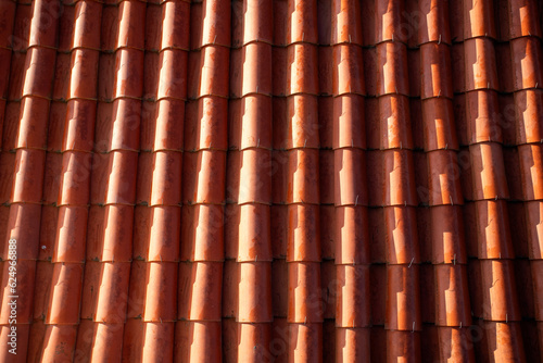 close up of residential roof made of brown tiles