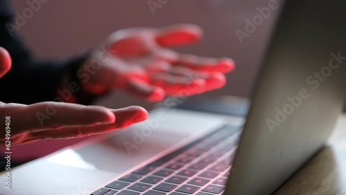 Businessman frustrated at laptop screen showing red warning or hacker virus attack, internet problem concept