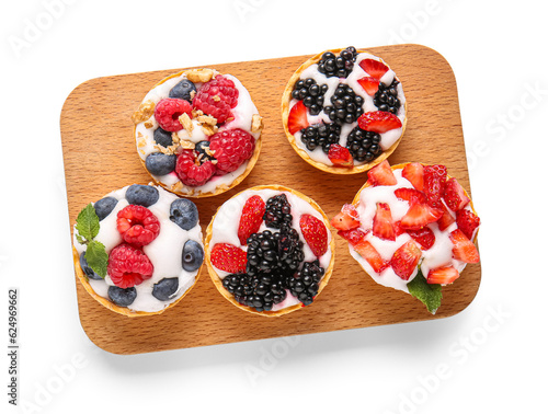 Assorted berry tarts with c...