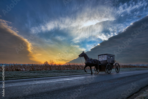 Amish buggy and cloud fronts in winter.