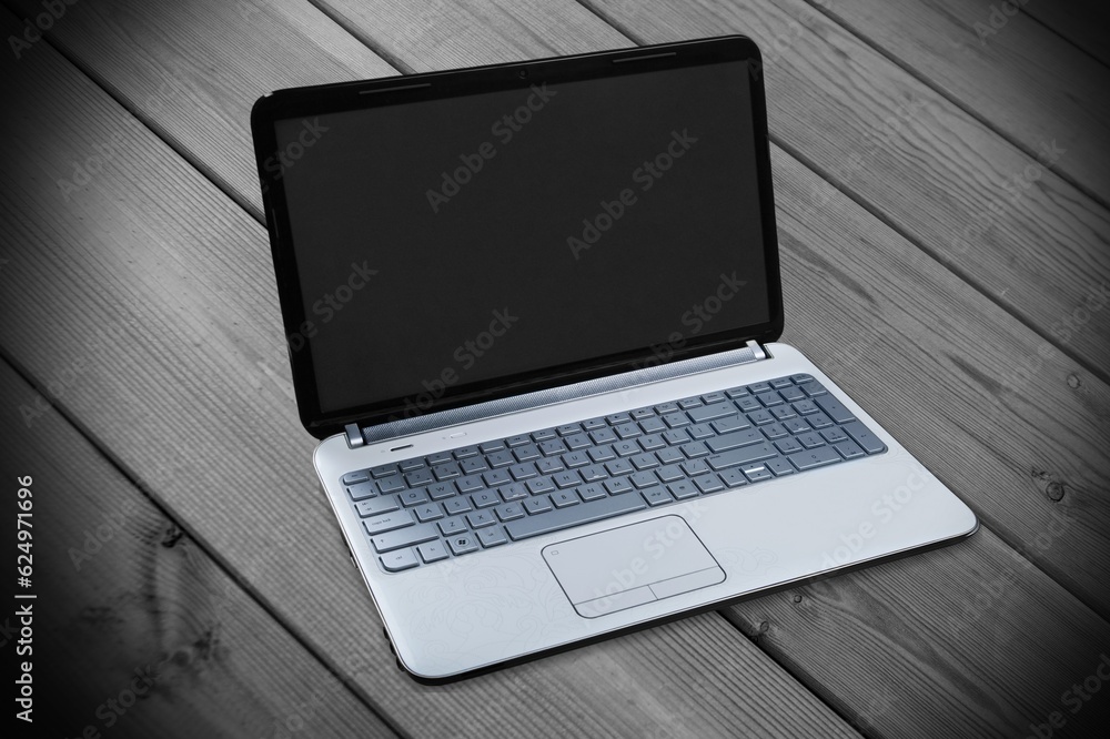 Open laptop with blank screen at the desk Open laptop with blank screen at the desk
