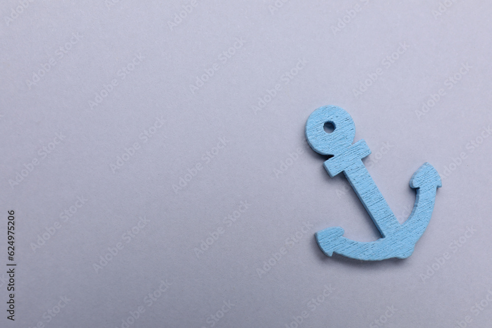 Anchor figure on light grey background, top view. Space for text Anchor figure on light grey background, top view. Space for text