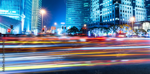 Canvas Print Moving car with blur light through modern city