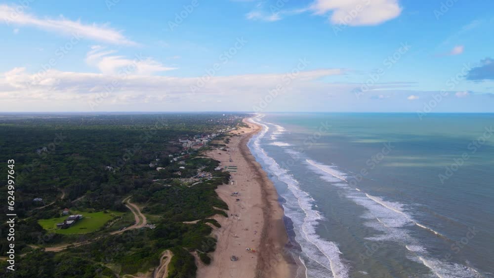 Drone shot flying along the beach in Cariló, Argentina.