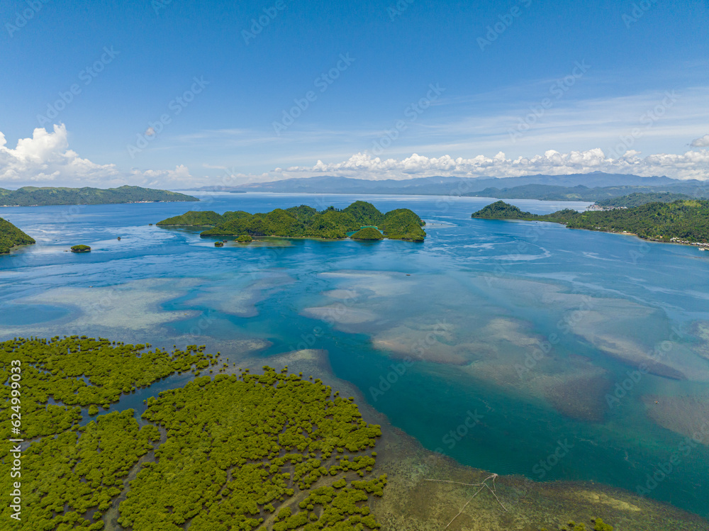 Tinago Island with turquoise water around. Seascape. Mindanao, Philippines.