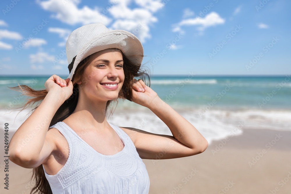Carefree happy young woman walking at beach Carefree happy young woman walking at beach