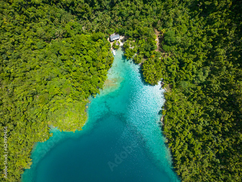 Top down view of Turquoise water and Rainforest of Tropical Island. Bucas Grande Island. Mindanao, Philippines. photo