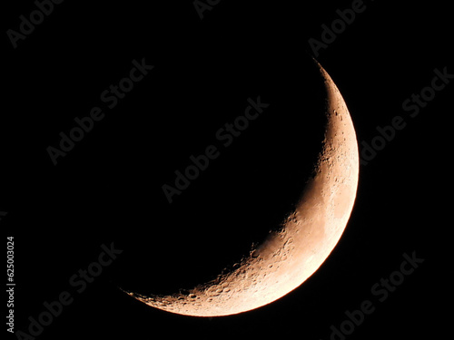 Waxing Crescent Quarter Moon in Black Sky