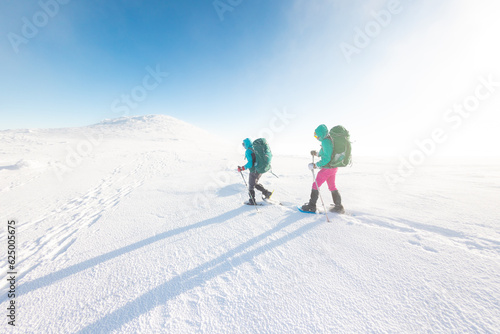 Winter mountain hiking in snowshoes