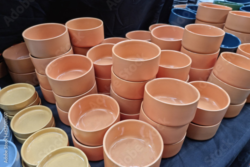 Orange terracotta coffee cups mixed together
