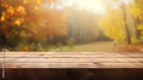 Wooden table space with autumn blur backround
