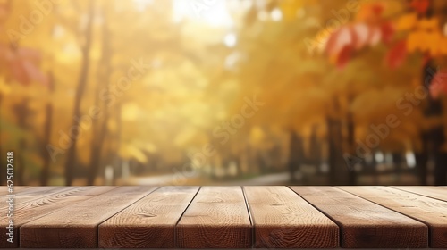 Empty wooden table space with autumn blur backround