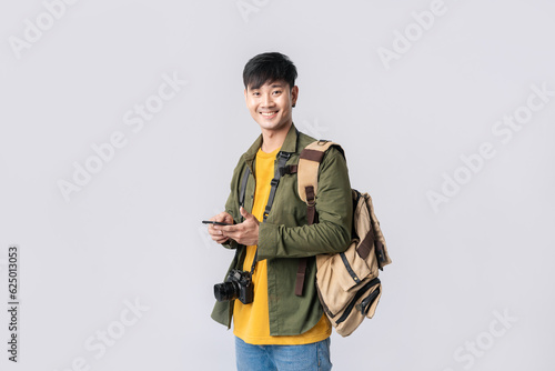 Photography Portrait young Asian man backpacker happy smile in formal shirt using smartphone trading or chatting or online shopping on isolated studio white background
