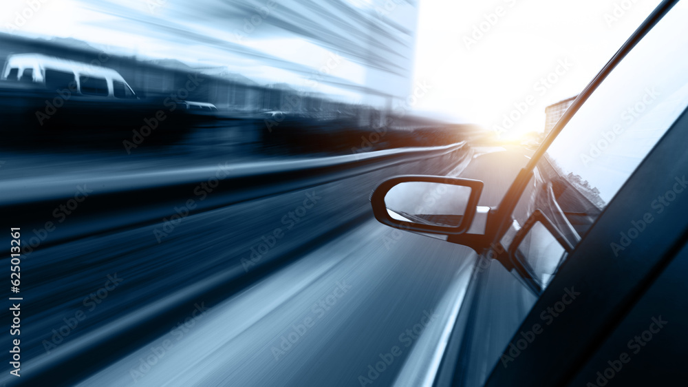 Car driving fast along the motorway, blue tone