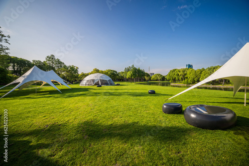 Camping tent on the grass in a sunny day