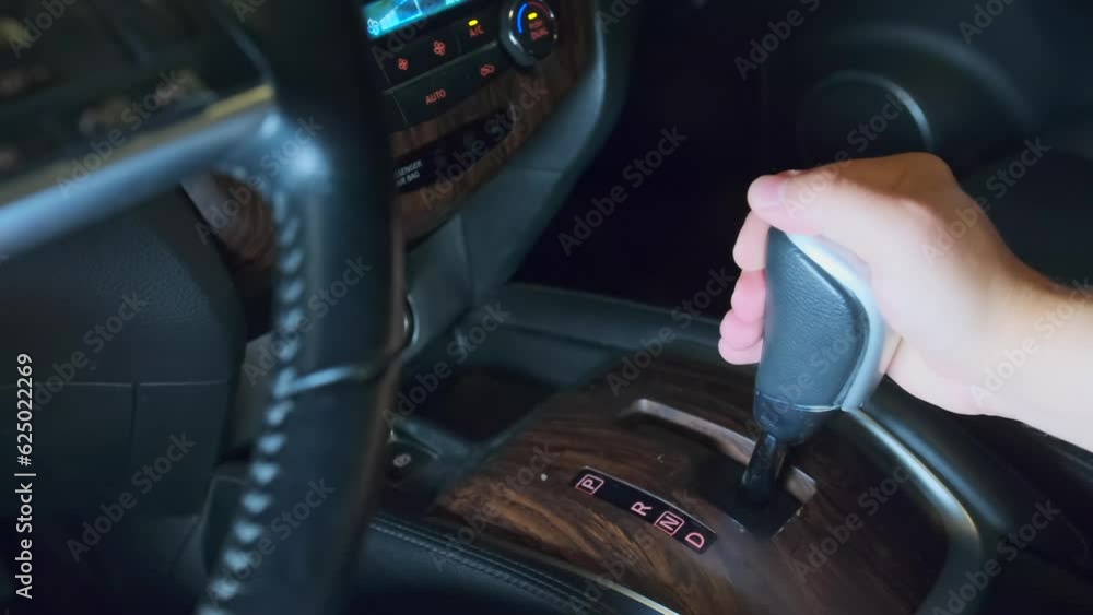 Driver shifting gear, moved from R to D. Start road trip exit parking