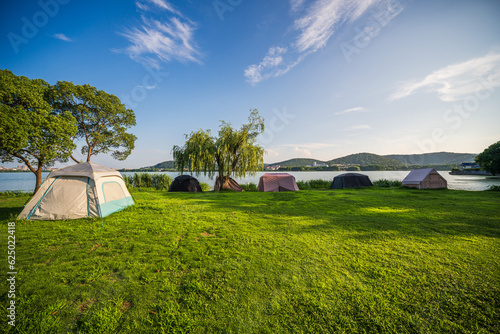 Fototapeta Naklejka Na Ścianę i Meble -  Camping tent on the grass in a sunny day