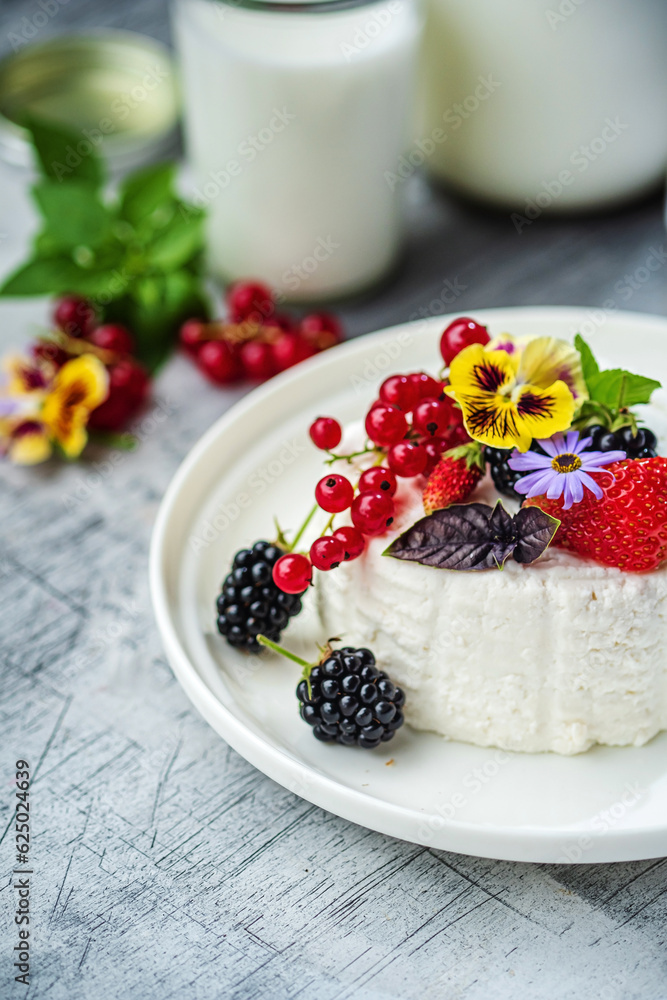 goat cheese with fresh berries and flowers goat cheese with fresh berries and flowers