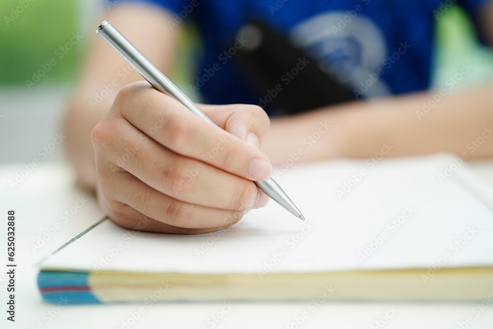Asian teenage student write homework, study lesson for exam online learning education. Asian teenage student write homework, study lesson for exam online learning education.