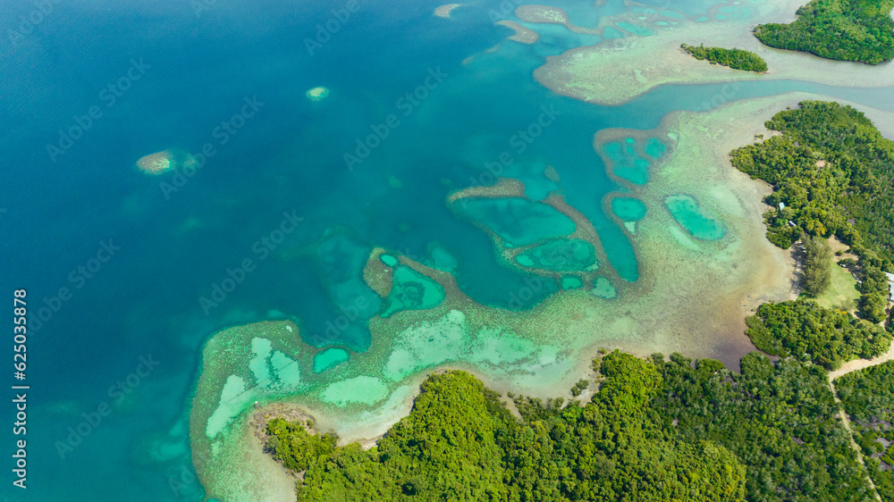 Top view of tropical bay and lagoons with turquoise water. Borneo, Sabah, Malaysia.