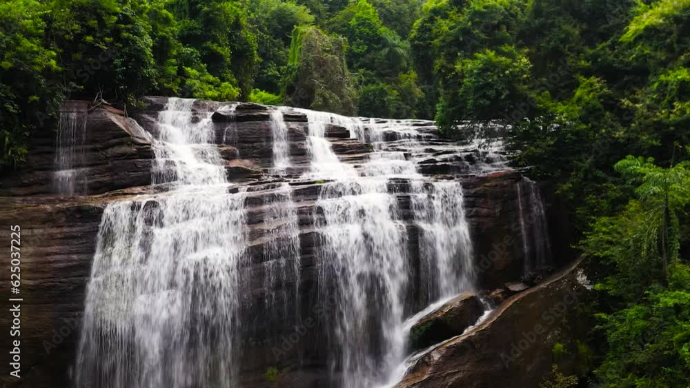 Waterfall in the rainforest, jungle. Aerial drone of Olu Ella Falls, Sri Lanka Waterfall in the rainforest, jungle. Aerial drone of Olu Ella Falls, Sri Lanka