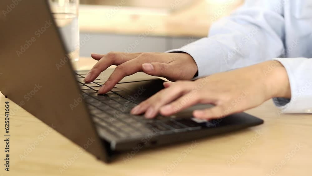 A girl in a white T-shirt works freelance remotely at home, close-up A girl in a white T-shirt works freelance remotely at home, close-up