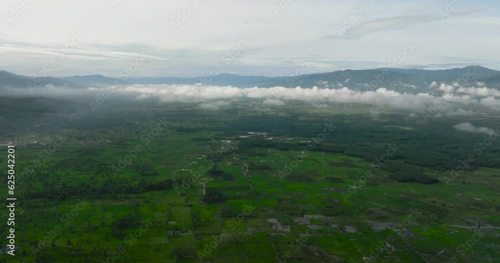 Aerial drone of countryside with farmland and rice fields. Sumatra, Indonesia. Aerial drone of countryside with farmland and rice fields. Sumatra, Indonesia.